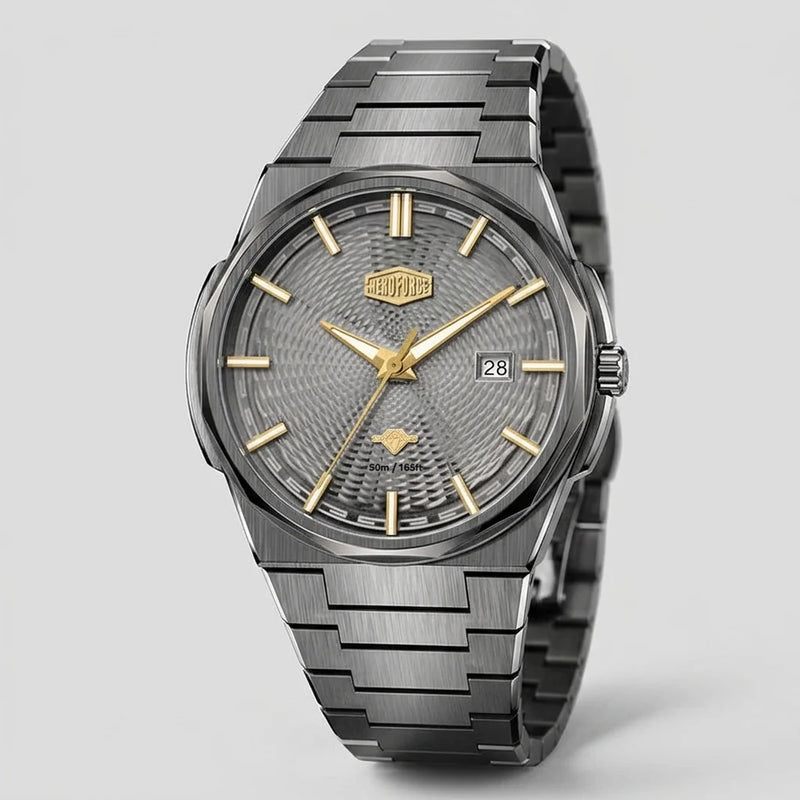 A Tag Heuer wristwatch with a dark gray textured dial, gold-tone hands and markers, and a brushed stainless steel link bracelet, shown on a light gray background.