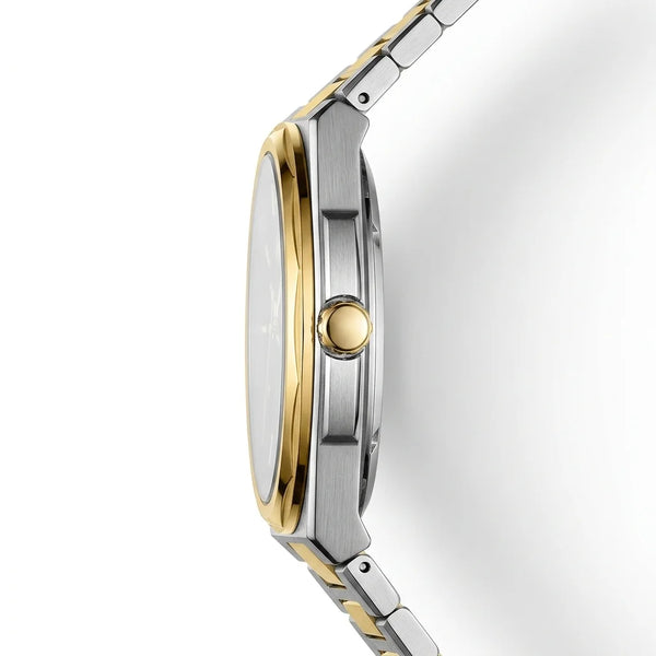 A close-up side profile of a two-tone stainless steel and gold watch with a silver dial and matching metal link bracelet, set against a clean white background.