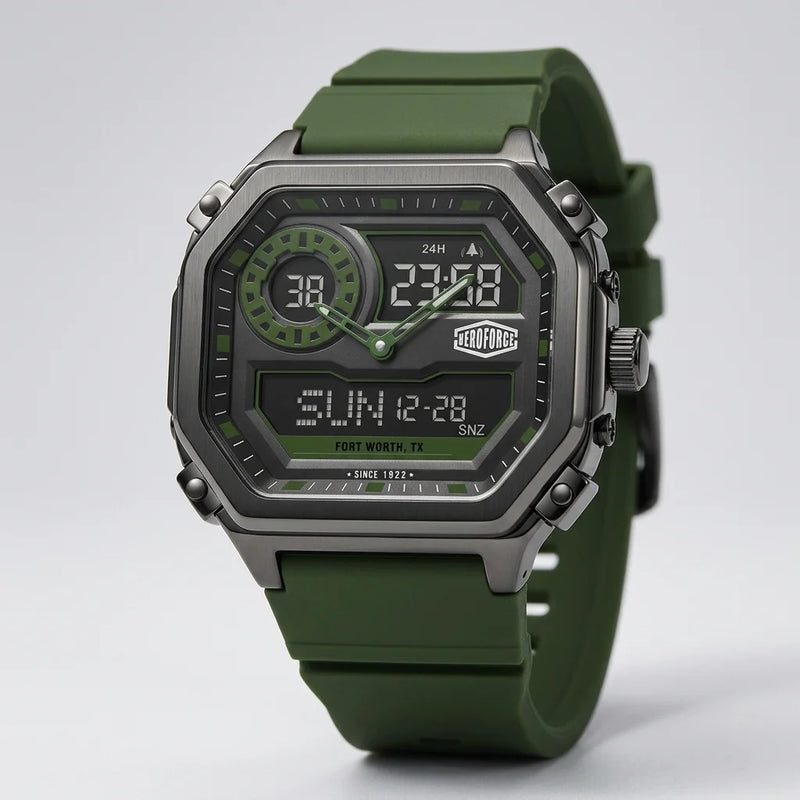 A rugged digital watch with an olive green silicone strap, a dark gray metallic case, and a black face with green accents, shown on a light gray background.