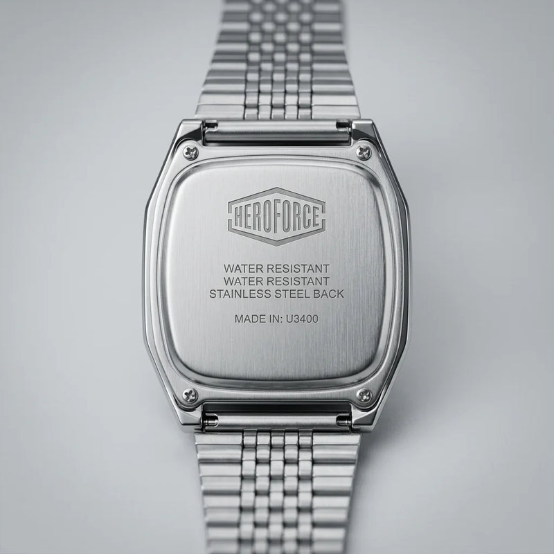 Back view of Silver digital wristwatch with rectangular face and segmented band, display showing brand “HEROFORCE"