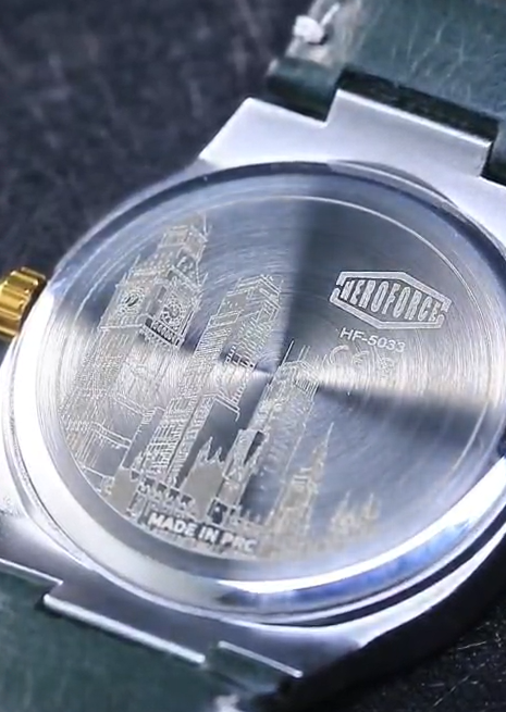 engraved watch caseback, cityscape detail