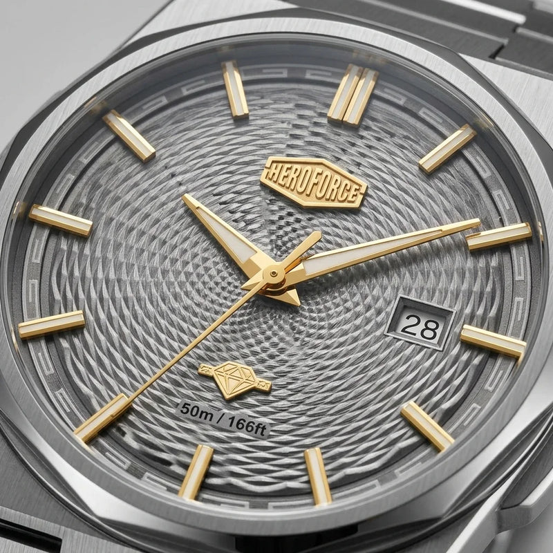 Close-up of a HEROFORCE men's watch featuring a textured gray dial, gold-tone hands and hour markers, and a silver-tone stainless steel case.