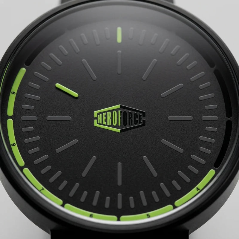 A close-up of a black green smartwatch with a black strap