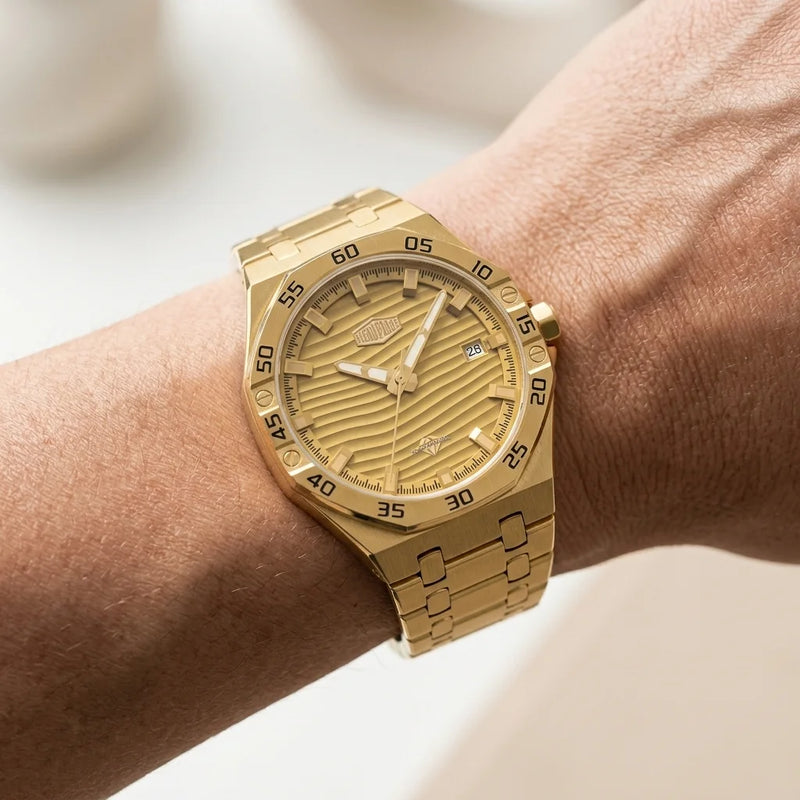 gold watch on wrist
