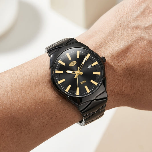 A close-up of a man's wrist wearing a modern analog watch with a black dial, gold-tone indices, and a dark gray segmented metal strap