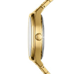 A close-up side profile of a gold-tone metal watch with a matching link bracelet, featuring a round crown button on a clean white background.