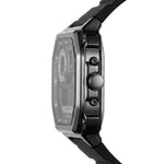 A close-up side profile of a modern analog watch with a black rubber strap, a metallic gunmetal gray case, and a dark dial, shown against a plain white background.