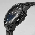 A close-up side view of a black stainless steel wristwatch with a dark blue dial and a black bezel featuring white minute markers.