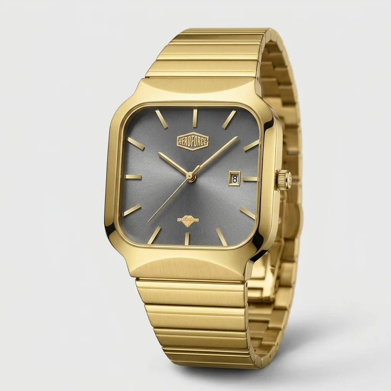 A gold-tone stainless steel watch with a rectangular, rounded square dial and a matching gold-tone metal link bracelet, shown on a light gray background.