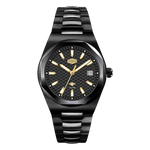 A men's analog watch with a black ceramic or textured resin link bracelet, a black dial with gold-tone indices and hands, and a date window at 3 o'clock, shown against a plain white background.