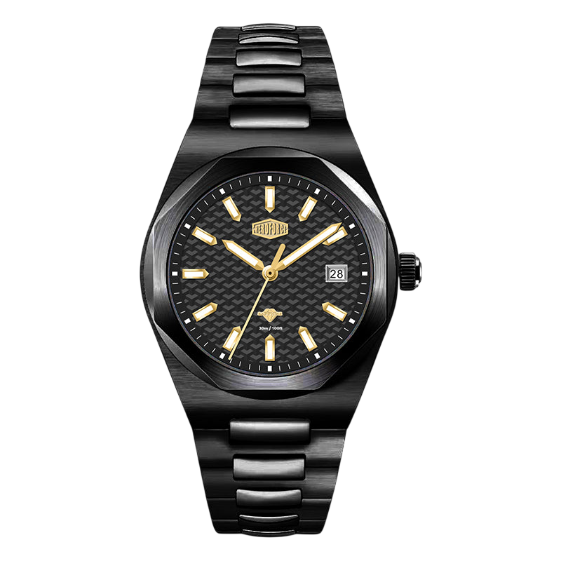 A men's analog watch with a black ceramic or textured resin link bracelet, a black dial with gold-tone indices and hands, and a date window at 3 o'clock, shown against a plain white background.
