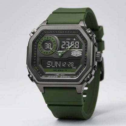A rugged digital watch with an olive green silicone strap, a dark gray metallic case, and a black face with green accents, shown on a light gray background.