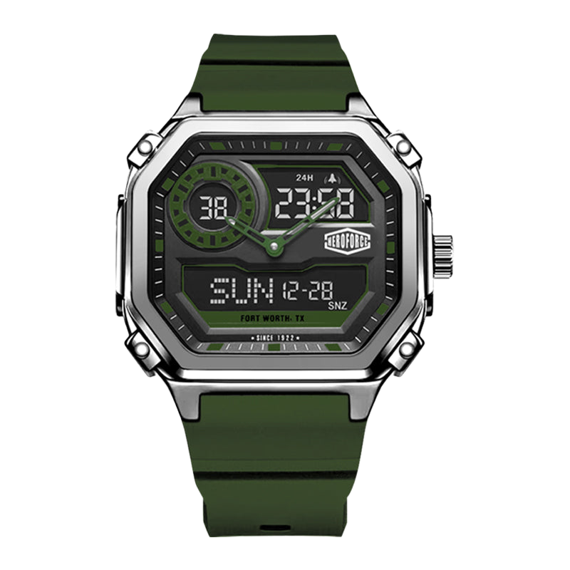 A rugged digital watch with an octagonal silver-tone metal case, a dark gray display face with green accents, and an olive green rubber strap, shown on a plain white background.
