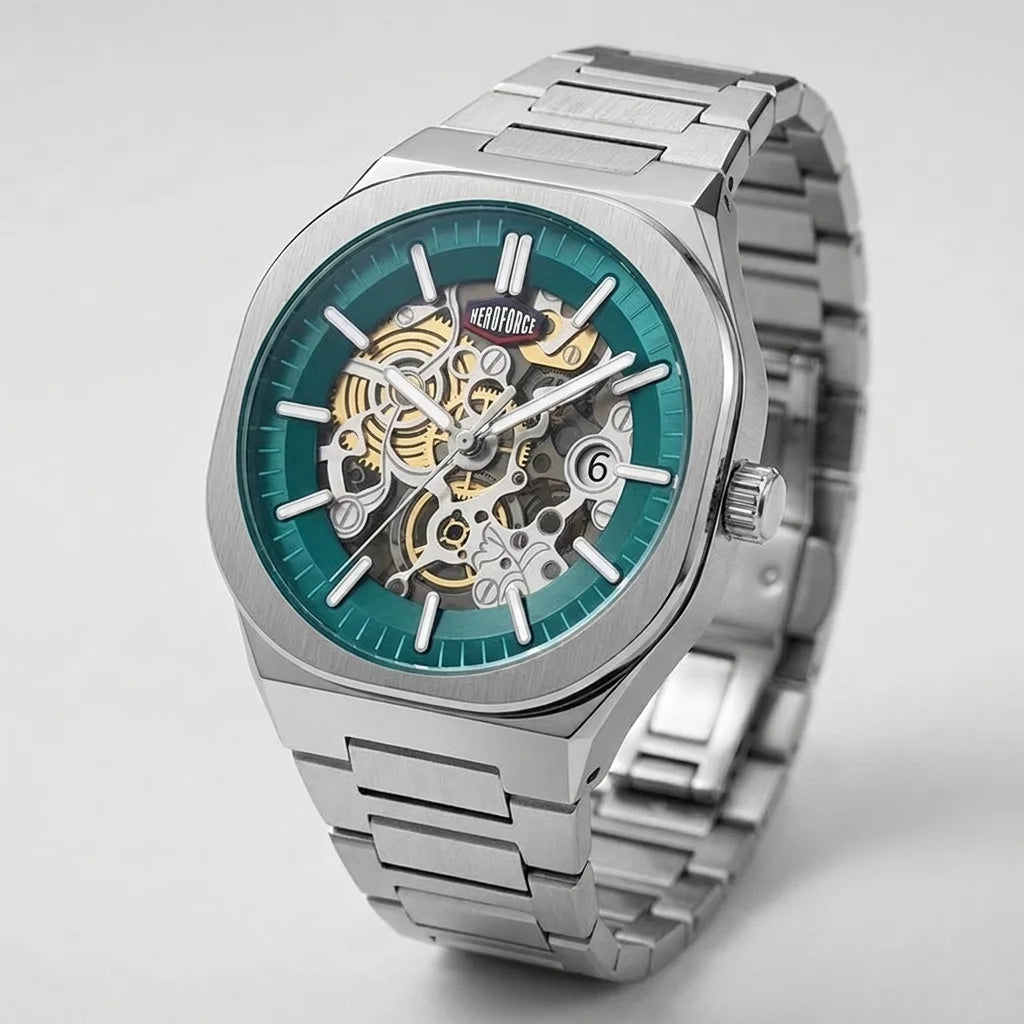A silver-tone stainless steel skeleton wristwatch with a teal blue dial, showcasing the intricate gold and silver mechanical movement through an open case.