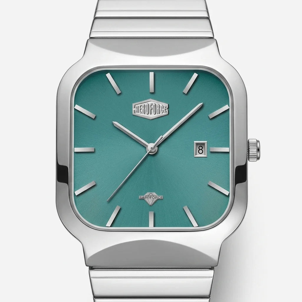 A silver-tone stainless steel wristwatch with a square bezel and a metallic teal-green dial, featuring silver stick indices, silver hands, a date window at 3 o'clock, and a matching metal link bracelet.