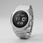 A silver stainless steel digital watch with a black face and white LED-style display, shown on a clean light gray background. The brand name 'HEROFORCE' is visible above the screen.