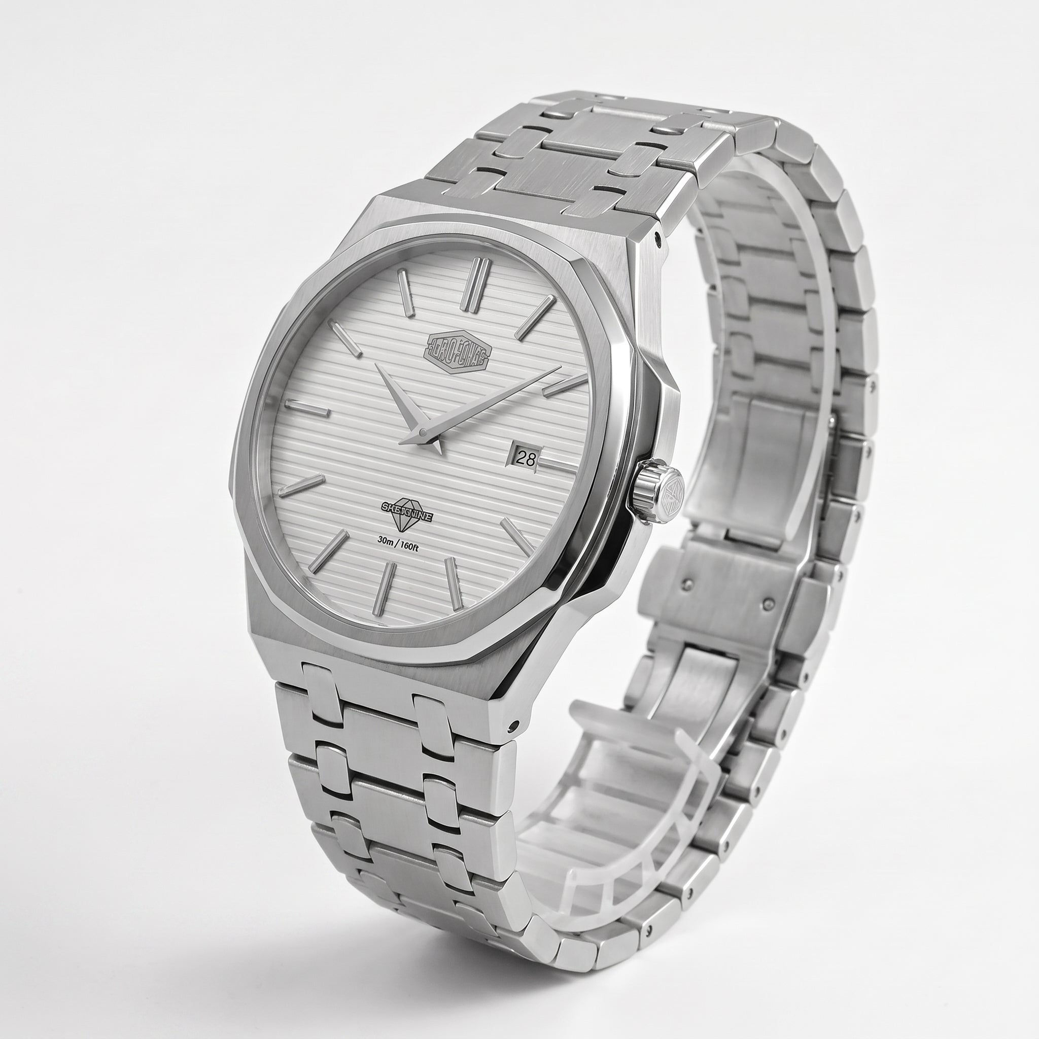 A silver stainless steel wrist watch with a matching link bracelet, featuring a white textured dial, silver hour markers, and a date window at the 3 o'clock position.