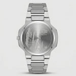 A stainless steel analog watch shown from the back, featuring an engraved London skyline design on the circular case back and a matching metal link bracelet, set against a light gray background.