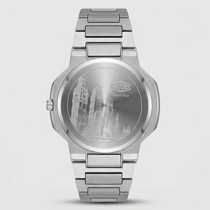 A stainless steel analog watch shown from the back, featuring an engraved London skyline design on the circular case back and a matching metal link bracelet, set against a light gray background.