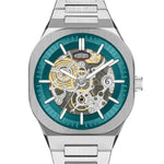 A stainless steel skeleton wristwatch with a teal blue inner dial ring and a visible gold and silver mechanical movement through the open dial.