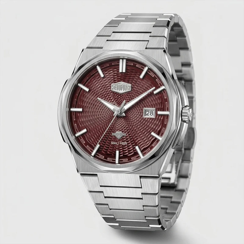 A stainless steel wristwatch with a textured burgundy-red dial and a matching metal link bracelet, shown on a light gray background.