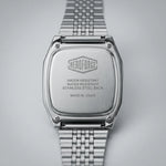 Back view of Silver digital wristwatch with rectangular face and segmented band, display showing brand “HEROFORCE"