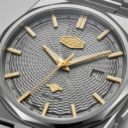 Close-up of a HEROFORCE men's watch featuring a textured gray dial, gold-tone hands and hour markers, and a silver-tone stainless steel case.