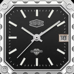 Close-up of a square analog watch face with a black dial, silver-tone hands and markers, a date window showing 18, and visible HEROFORCE and SAPWIRE branding.