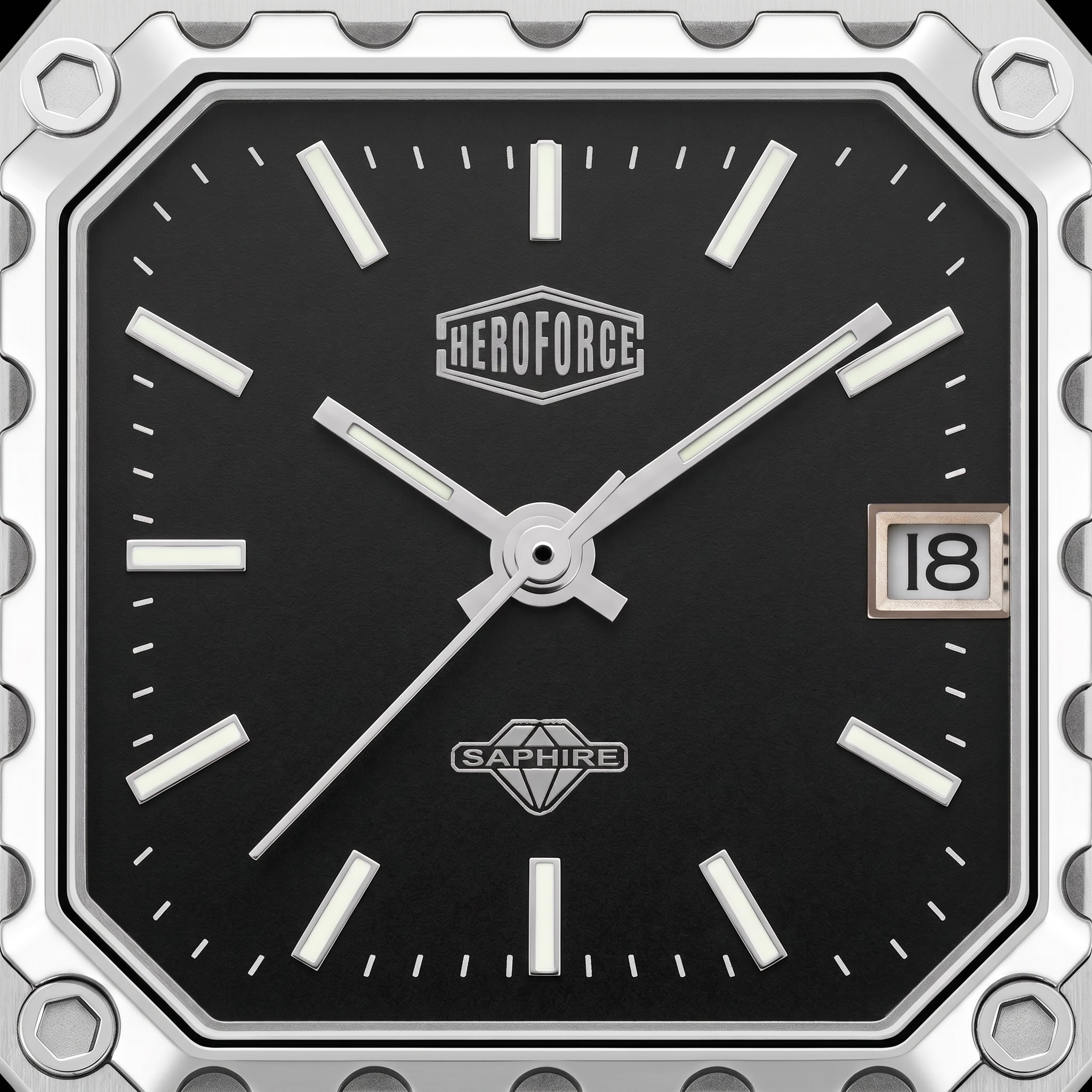 Close-up of a square analog watch face with a black dial, silver-tone hands and markers, a date window showing 18, and visible HEROFORCE and SAPWIRE branding.