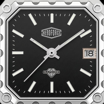 Close-up of a square analog watch face with a black dial, silver-tone hands and markers, a date window showing 18, and visible HEROFORCE and SAPWIRE branding.