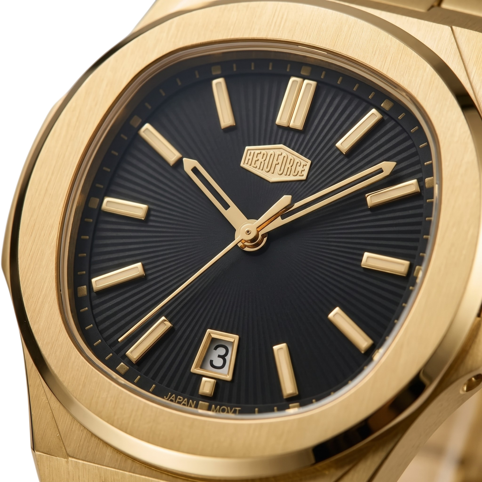 Close-up of a wristwatch with a brushed gold-tone case and a black sunburst dial featuring gold-tone hour markers and hands.