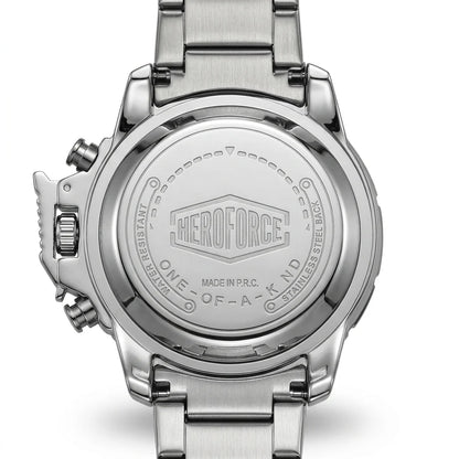 Close-up of the back of a stainless steel wristwatch with a metal link band, showing engraved branding and text on the case back.