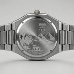 Close-up of the back of a stainless steel wristwatch with a metal link bracelet. 