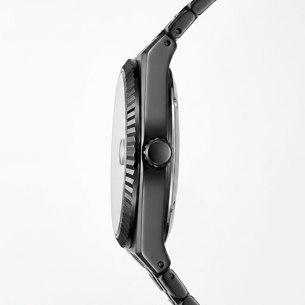 Close-up side profile of a black analog watch with a textured bezel, round crown, and matching black link band on a light gray background.