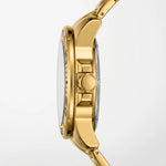 Close-up side profile of a gold-tone watch with a silver-toned inner bezel and silver crown, shown on a clean white background.