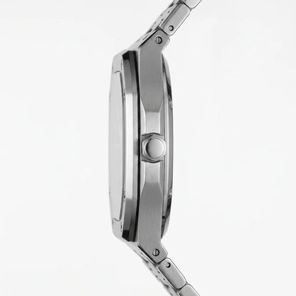 Close-up side profile of a stainless steel watch with a teal dial on a clean white background.