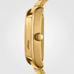 Close-up side view of a gold-tone watch case and matching metal link bracelet on a light gray background.