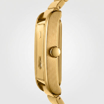 Close-up side view of a gold-tone watch case and matching metal link bracelet on a light gray background.