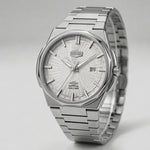 Full form of HEROFORCE wristwatch with silver bracelet, guilloché patterned dial, polished angular bezel, silver markers and hands, date window at 28, brushed steel finish.
