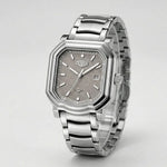 Full frontal view - Silver wristwatch with octagonal rectangular case, metallic bracelet, gray textured dial, silver markers, and date window