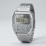 Full frontal view of Silver digital wristwatch with rectangular face and segmented band, display showing brand “HEROFORCE,”