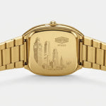 Gold-tone stainless steel watch case and bracelet, shown from the back with an engraved London cityscape.