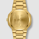 Gold-tone stainless steel watch shown from the back, featuring an engraved cityscape design on the case and a matching metal link bracelet against a light gray background.