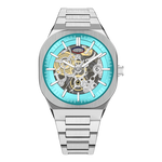 HEROFORCE silver wristwatch with turquoise outer ring, skeleton dial exposing intricate gold and silver gears, white hands with silver outline, date window at 6, modern horology design.