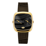 A luxury watch featuring a square cushion-shaped gold-tone case, a black dial with a smaller circular subdial and gold hands, and a dark brown alligator-embossed leather strap.
