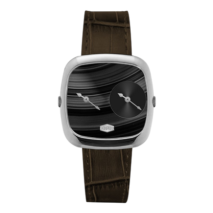 A modern square analog watch with a silver-toned case, a black marbled dial featuring a small black subdial, and a dark brown alligator-textured leather strap.