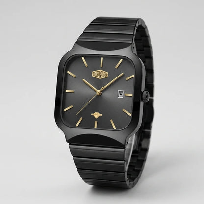 A HEROFORCE wristwatch with a matte black ceramic case and integrated link bracelet, featuring a black dial with gold-tone indices and hands, and a date window at 3 o'clock.