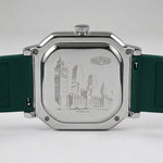 The back of a HeroForce watch with a silver-toned metal case and a dark green textured silicone strap, featuring an engraved city skyline design.
