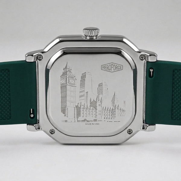 The back of a HeroForce watch with a silver-toned metal case and a dark green textured silicone strap, featuring an engraved city skyline design.