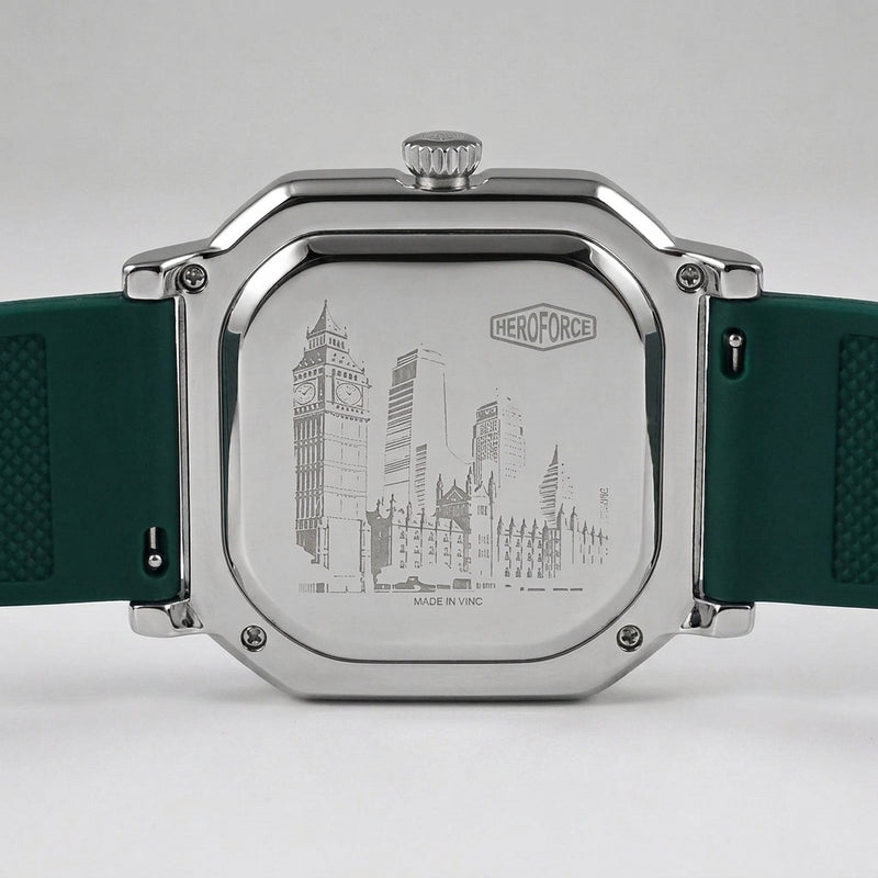 The back of a HeroForce watch with a silver-toned metal case and a dark green textured silicone strap, featuring an engraved city skyline design.